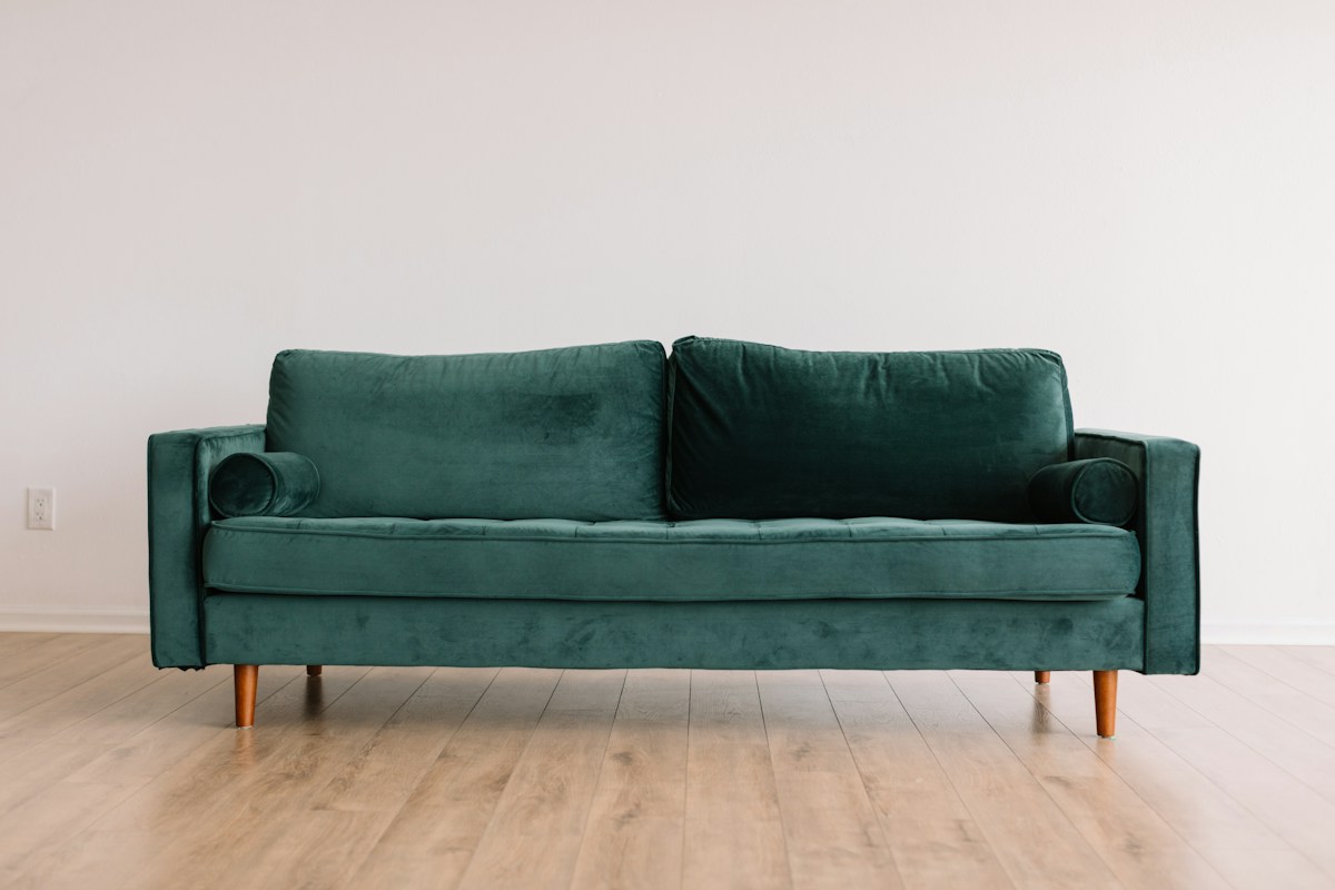 Elegant green chenille sofa in a contemporary living room setting